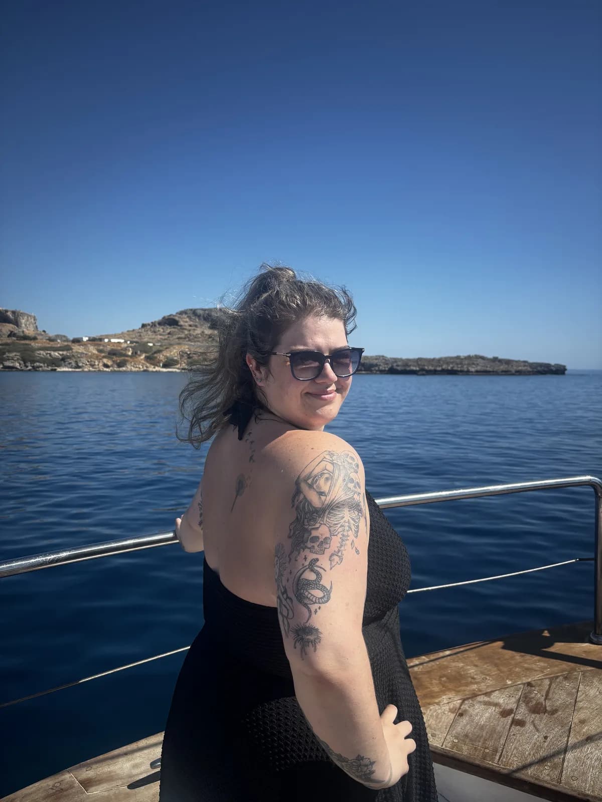 Alex looking back over a shoulder on the boat