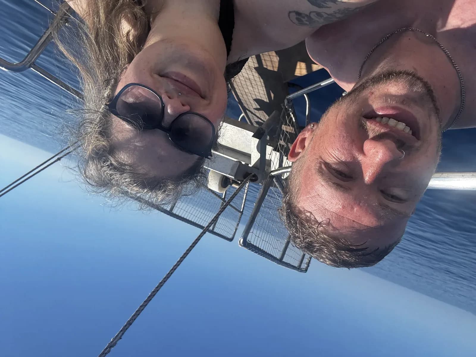 Nath and Alex smiling on the boat