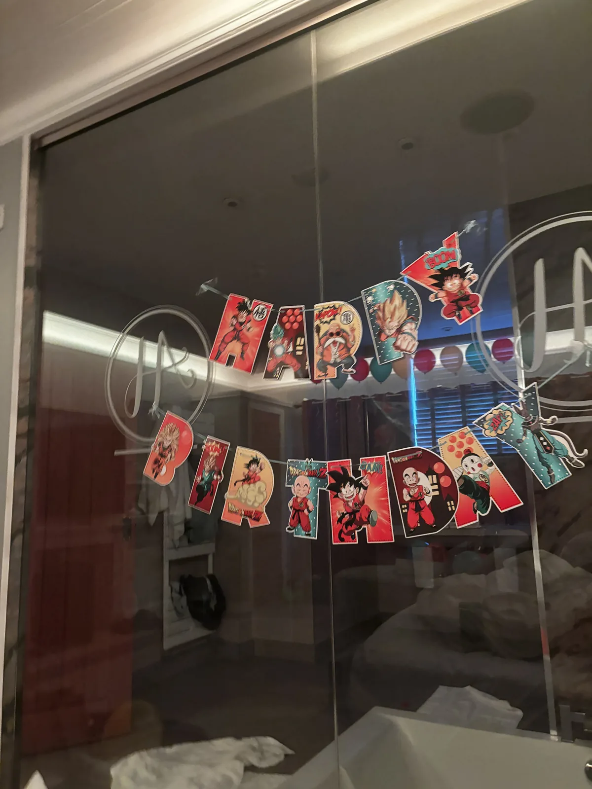 Dragon Ball Happy Birthday banner on the glass