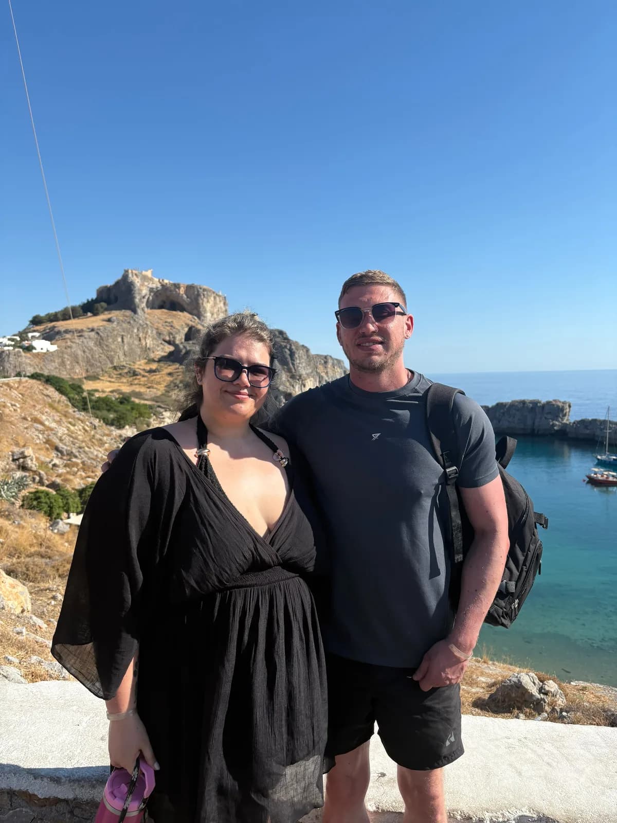Standing together overlooking the coast