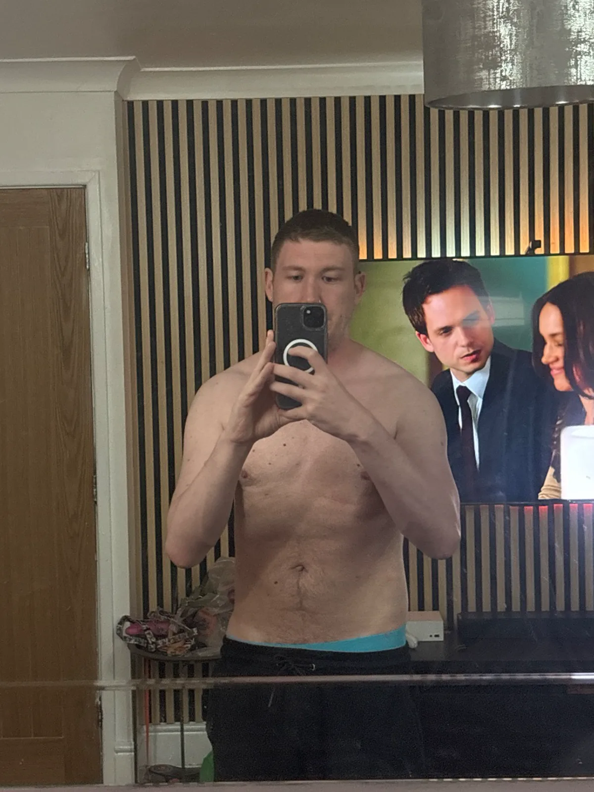 Progress photo 2: mirror selfie against wood slat panelling